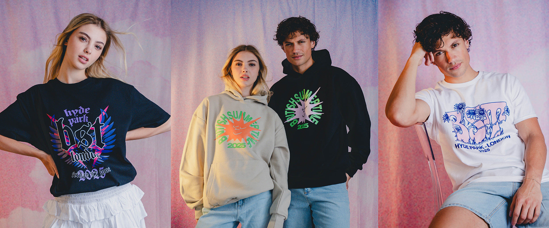 Four young adults model graphic streetwear, including T-shirts and hoodies with bold, colorful designs and text, standing and sitting against a soft, pastel backdrop.